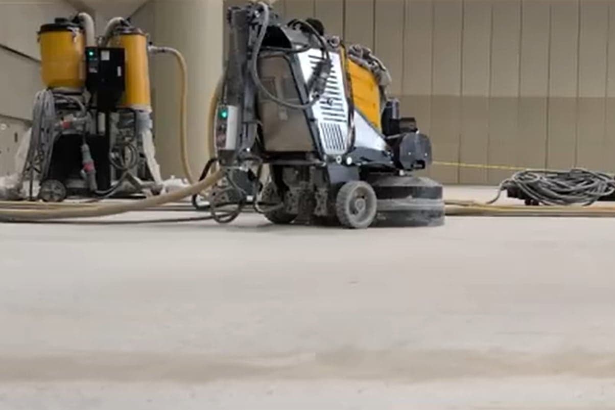 Diamond floor grinding equipment preparing a concrete slab
