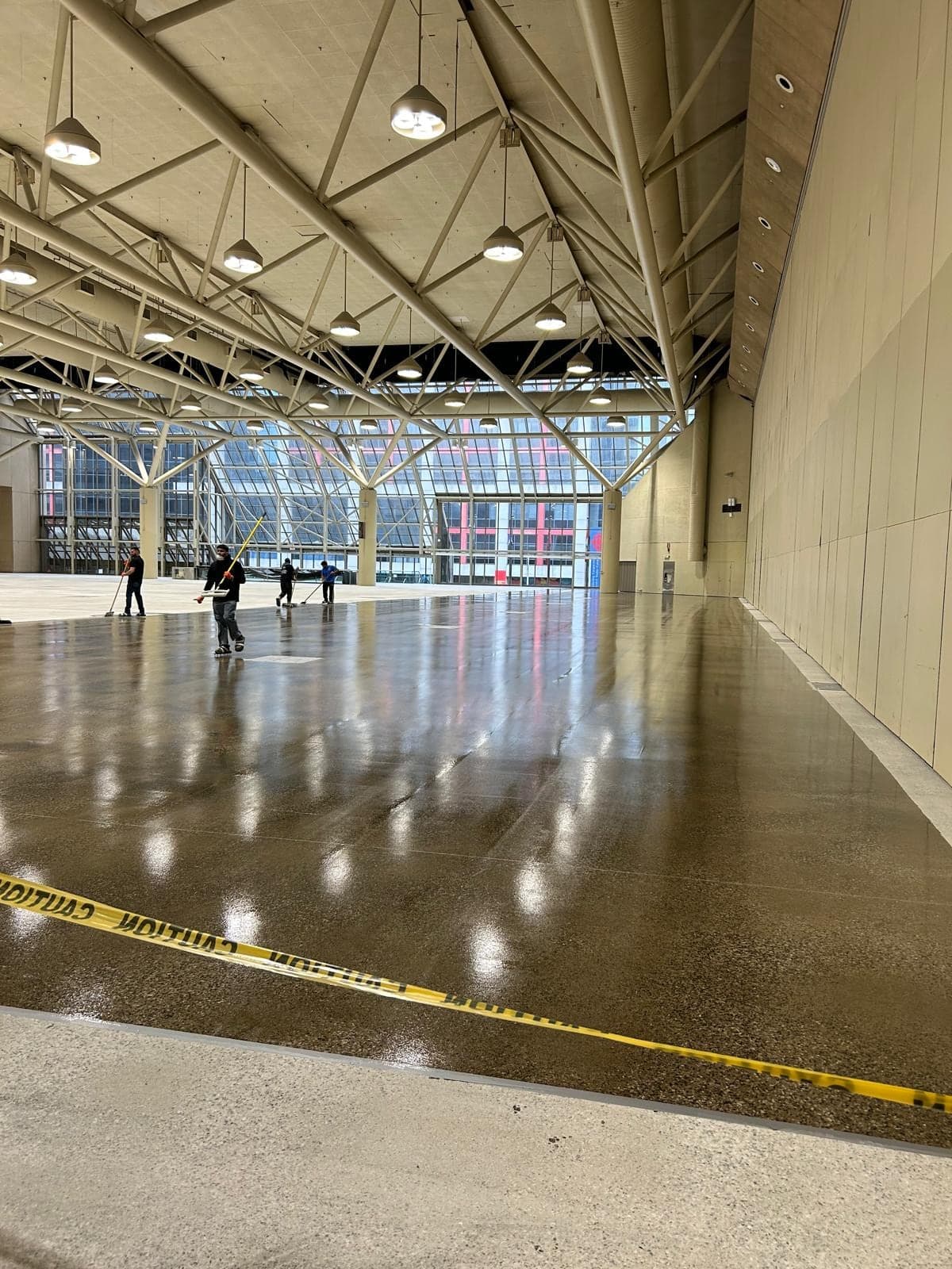 Polished concrete floor in a large convention hall by AR Construction
